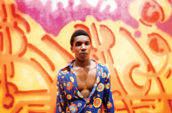 bama-poses-in-front-of-his-painting-orange-juice-at-the-razor-gallery-1973-photos-by-herbert-migdoll