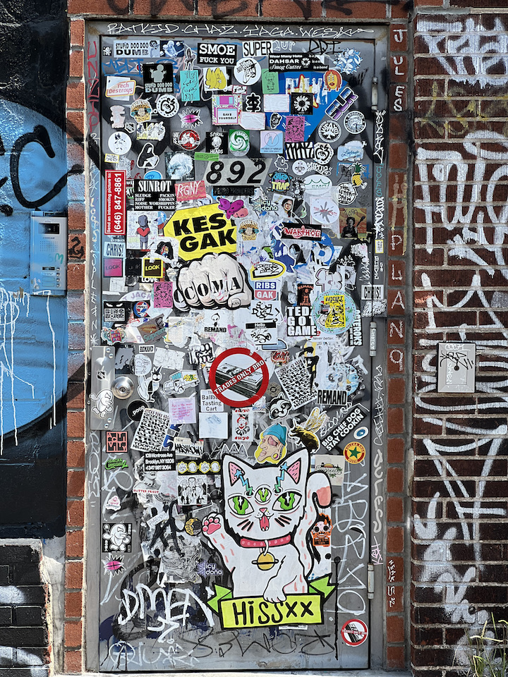 Baser-graffiti-sticker-collage-in-NYC
